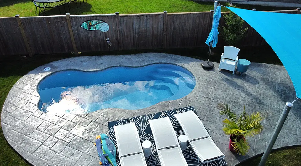 A fibreglass pool at Noble with smooth curves and a clean surround