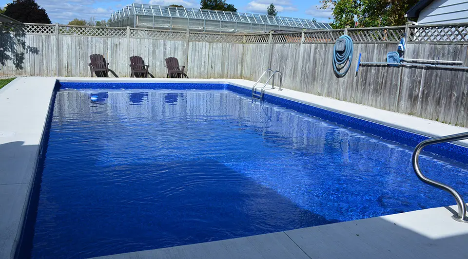 A renovated pool with new liner and surround at a Bell Avenue property