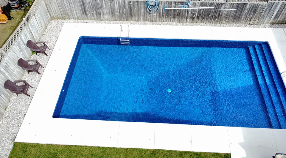 A Bell Avenue pool renovation showing fresh liner and new landscaping
