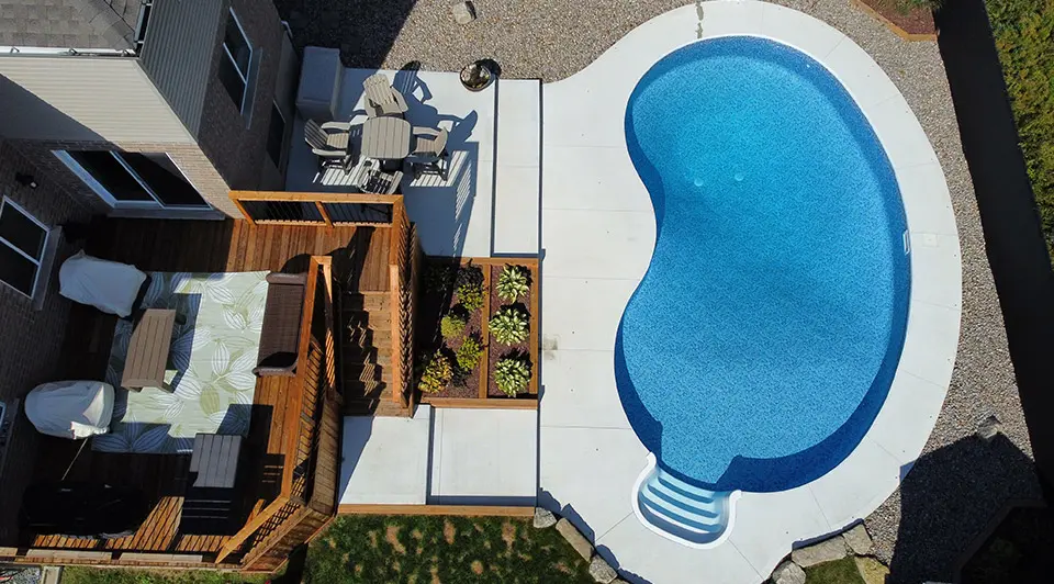 A clean vinyl pool being opened for the season with fresh water and clear skies